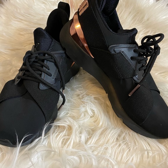 black and rose gold puma muse